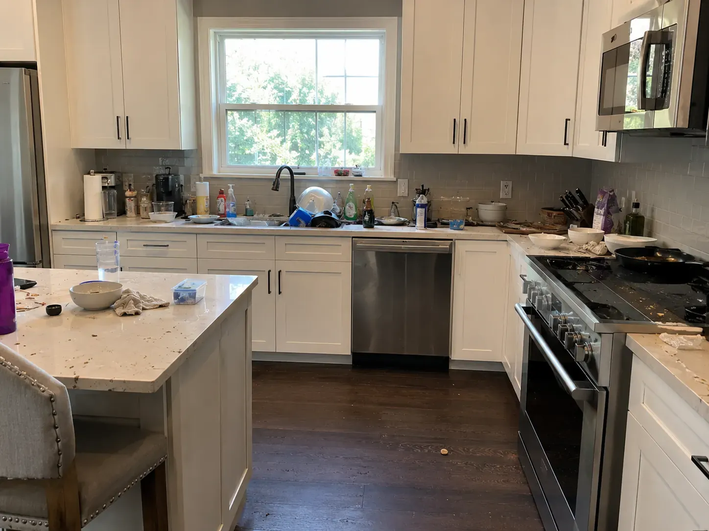 Kitchen in a Fort Worth property before post-construction cleaning, with debris and dust across the counters